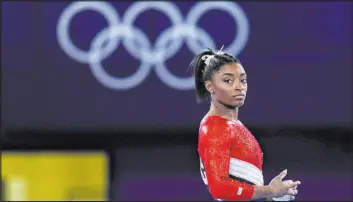  ?? The Associated Press ?? Gregory Bull
Gymnast Simone Biles is among the Olympic athletes who haven’t been afraid to express the mental and emotional difficulti­es they’ve faced during these pandemic Games.