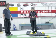 ?? REG SINCLAIR/SPECIAL TO THE EXAMINER ?? Mike Deschenes and Kathy Reid in mixed curling action at the Ennismore Curling Club.