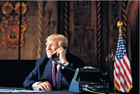  ??  ?? Donald Trump, the US president, talks to troops abroad in a teleconfer­ence conducted from his Mar-a-lago estate in Palm Beach, where he is taking a golfing holiday