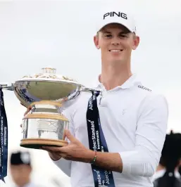  ?? PICTURE: REUTERS ?? THAT WAS FUN: South Africa’s Brandon Stone celebrates with the trophy after winning the Scottish Open at Gullane GC Scotland on Sunday.
