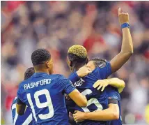  ?? MARTIN MEISSNER/ASSOCIATED PRESS ?? United’s Paul Pogba raises his arm after scoring the opening goal during Wednesday’s 2-0 win over Ajax in the Europa League final. The game was played days after a bomb exploded in Manchester.