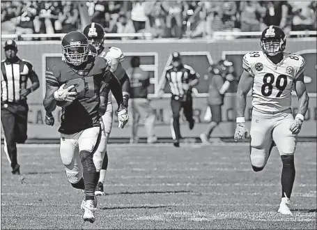  ?? [ASSOCIATED PRESS FILE PHOTO] ?? The Steelers’ Vance McDonald, right, chases down the Bears’ Marcus Cooper after a blocked field goal attempt last Sunday. McDonald knocked the ball away from Cooper near the goal line to prevent a touchdown.