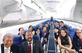  ??  ?? TRYING OUT THE Q400. Philippine Airlines (PAL) president/ chief operating officer Jaime Bautista, Canada Senator Tobias Enverga Jr., Rosemer Enverga and Antonio Ajero. At the back are Doris Dumlao Abadilla of Philippine Daily Inquirer, PAL’s Monet...