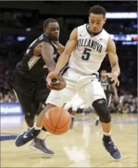  ?? JULIE JACOBSON — THE ASSOCIATED PRESS ?? Villanova’s Phil Booth is back on the court, and lead a young team of Wildcats this season. will be counted on to