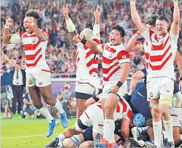  ?? Picture: WORLD RUGBY ?? Japanese players celebrate after their final pool game against Scotland on Sunday.