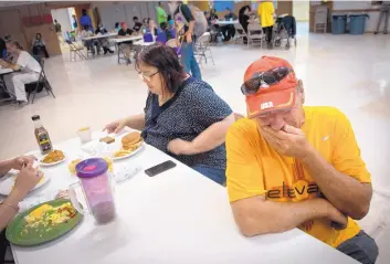  ?? MARLA BROSE/JOURNAL ?? Joy Junction resident Daniel Stark gets emotional Friday when talking about his friend, Jeremy Reynalds, the founder of the homeless shelter who died earlier this week. Sitting next to him is resident Stephanie Richardson, who said Reynalds “touched so many lives. I don’t think he even knew how many lives he touched.”