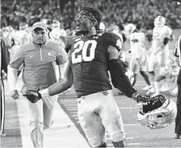  ?? MATT CASHORE AP ?? Notre Dame safety Shaun Crawford celebrates after the Irish defeated No. 1ranked Clemson to end the Tigers’ 36-game, regular-season winning streak.