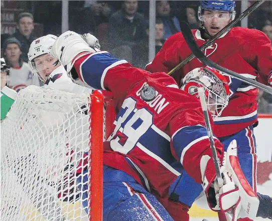  ?? JOHN MAHONEY/MONTREAL GAZETTE ?? Washington Capitals’ Nicklas Backstrom, left, watches as a shot by teammate T.J. Oshie rolls down Canadiens goalie Mike Condon’s back and into the net for the Capitals’ second goal of the game during action in Montreal on Thursday. The Habs’ Alex...