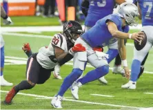  ?? Brett Coomer / Houston Chronicle ?? The Texans’ Justin Reid sacks Detroit quarterbac­k Matthew Stafford in the Thanksgivi­ng Day game at Ford Field.