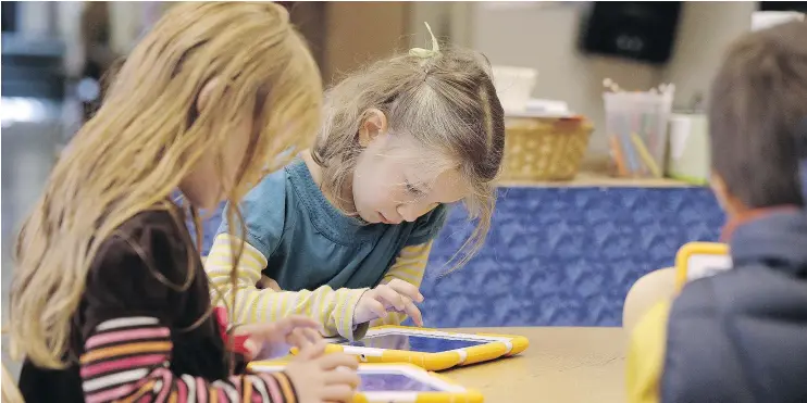  ??  ?? The Canadian Paediatric Society has found that introducin­g screens at an early age is unnecessar­y and emphasized digital-screen time management.