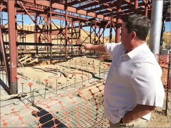  ?? Austin Dave /The Signal ?? Project manager Randy Wrage points to where a performing arts center will stand at the site of the future Castaic High School during a field tour on Friday.