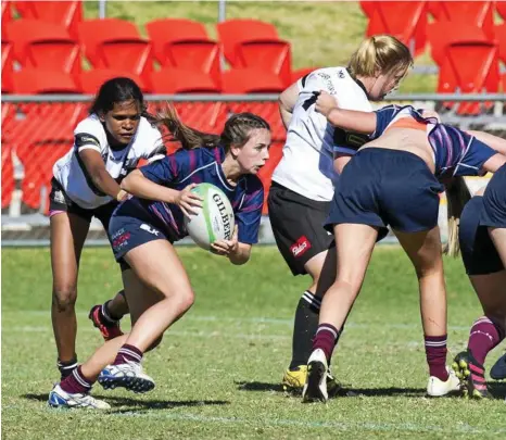  ?? PHOTO: NEV MADSEN ?? MAKING GROUND: The new national women’s rugby competitio­n will create more opportunit­ies for Darling Downs players like those in this year’s Women’s Sevens grand final between Toowoomba Bears and Warwick Water Rats.