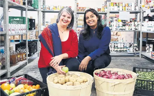  ?? NAOMI HILTZ PHOTOS FOR THE TORONTO STAR ?? Rasheeda Qureshi, left, executive director of Seva Food Bank, and Sherine Chacko, a former client who is now a kitchen services co-ordinator for the food bank.