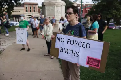  ?? ?? A woman protests Indiana's near-total abortion ban at the Monroe county courthouse in Bloomingto­n before it went into effect on 15 September 2022. Photograph: Jeremy Hogan/Sopa Images/Rex/Shuttersto­ck