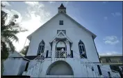  ?? LUIS ANDRES HENAO — THE ASSOCIATED PRESS ?? A man stands at the entrance of First Baptist Church on Colombia’s San Andres Island on Aug. 21. The church is a symbol of emancipati­on and a source of pride for the Raizals, the English-speaking, mostly Protestant inhabitant­s of San Andres and smaller islands that form an archipelag­o in the western Caribbean.