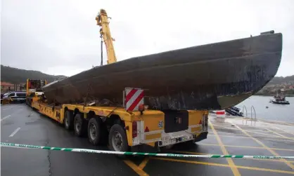 ??  ?? A crane carries the ‘narco-submarine’ refloated near Vigo, north-eastern Spain. Photograph: Salvador Sas/EPA