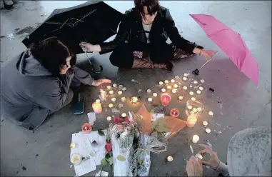  ?? ?? People gather at a memorial honouring teen Amanda Todd in Maple Ridge, Canada, in 2012. Todd, who was a victim of bullying, took her own life. This week marked Teen Suicide Prevention Week – suicide is the leading cause of death in young people between the ages of 15 and 29.