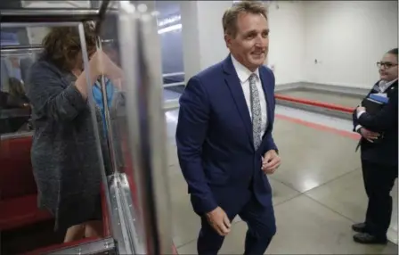  ?? J. SCOTT APPLEWHITE — THE ASSOCIATED PRESS ?? Sen. Jeff Flake, R-Ariz., a member of the Foreign Relations Committee, returns to his office after a closed-door security briefing at the Capitol in Washington, Wednesday.