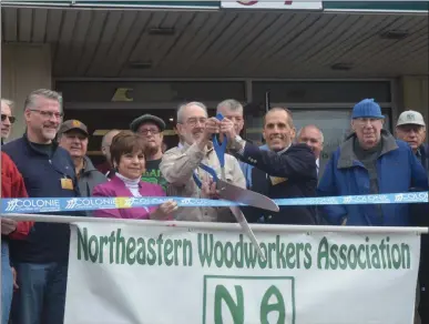  ?? LAUREN HALLIGAN - MEDIANEWS GROUP ?? A ribbon cutting ceremony is held on Wednesday for the grand opening of the Northeaste­rn Woodworker­s Associatio­n’s new Herm Finkbeiner Learning Center in Colonie.