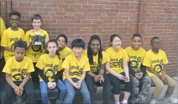  ?? SUBMITTED PHOTOS ?? Members of the Berry Elementary STEMtastic Jaguars, in front from left, Jonathan Parham, Isabella Caudill, Joshua Hong, Jordyn Robinson, Caleb Terrell and Jeremiah Severe, and back from left, Elias Bend, Jaxon Rhea (with robot) and Julien Carmona, compete in the VEX Worlds — VEX IQ Challenge Elementary School Division competitio­n April 23-25 in Louisville, Ky.