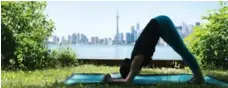  ?? COLE BURSTON/TORONTO STAR ?? YuMee Chung practises the Dolphin Push-Up on the Toronto Islands.