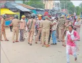  ?? PTI ?? Policemen guarding a street in Banda town of Shahjahanp­ur after tension between two communitie­s on Saturday.