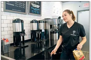  ?? Philadelph­ia Inquirer/JESSICA GRIFFIN ?? Alyssa Bennett, student cafe executive officer, works at Saxbys cafe in West Philadelph­ia late last month.