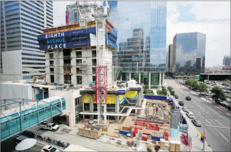  ?? Calgary Herald/files ?? Constructi­on continues on the new Eighth Avenue Place office tower as a low vacancy rate in downtown Calgary spurs new constructi­on.