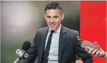  ?? CHRISTOPHE­R KATSAROV THE CANADIAN PRESS ?? National team head coach John Herdman discusses the North American bid by Canada, the U.S. and Mexico to host the 2026 World Cup.