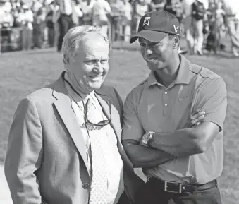  ??  ?? Jack Nicklaus, left, talks with Tiger Woods after Woods won the 2012 Memorial Tournament at Muirfield Village Golf Club in Dublin, Ohio. The Memorial Tournament was to be the first event in the PGA Tour’s restart to include fans, albeit in limited numbers. That plan changed on Monday when the Tour announced that the event would instead go off without fans – like the previous four events played over the past month – and also without a pro-am.