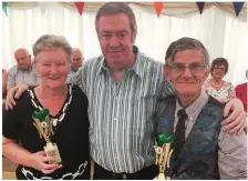  ??  ?? BELOW LEFT: Winners of the Dan Paddy Andy Festival waltzing competitio­n: Ann Reidy and Joe Burke with judge Michael Murphy.