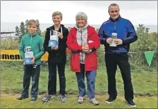  ??  ?? Winners of the putting competitio­n were, l to r, Torren and Brodie Hart who won the child and teenager category while Alice Martin and Jamie McPherson retained their titles in the ladies and gents competitio­ns.
