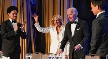  ?? Patrick Semansky / Associated Press ?? President Joe Biden and first lady Jill Biden arrive at the White House Correspond­ents’ Associatio­n dinner Saturday in Washington. At left is comedian Trevor Noah.