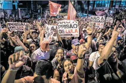  ??  ?? Set him free: Supporters protest against former president Lula da Silva’s 12-year prison term. The popular leader’s absence from the ballot in October’s elections has left the field wide open. Photo: Marcelo Chello/AFP