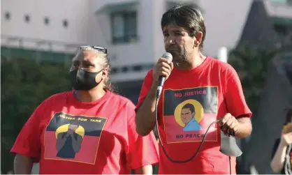  ?? Photograph: Richard Milnes/REX/Shuttersto­ck ?? Colin and Nioka Chatfield at the Black Lives Matter protest in Sydney. ‘There are lots of unanswered questions,’ Nioka said at the inquest.