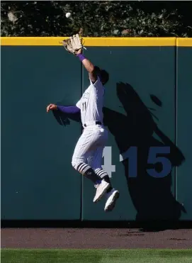  ?? Getty ImaGes ?? HE’S GOT IT: Former Red Sox outfielder Kevin Pillar made a leaping catch in center field during the Rockies’ 9-6 win over the Giants yesterday. Pillar also had an RBI triple to give Colorado the lead late in the game.