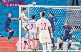  ?? AP ?? Spain's Aymeric Laporte (2nd from left) scores his side's second goal during the Euro 2020 match against Slovakia at La Cartuja stadium in Seville on Wednesday