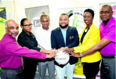  ?? CONTRIBUTE­D ?? Omar Palmer (third left), consumer division marketing manager at LASCO Distributo­rs, shares a photo with (from left) Christophe­r Samuda, Jamaica Olympic Associatio­n (JOA) president; Lisa Spence, event coordinato­r for Starlight Production; Ryan Foster, JOA secretary general; Paula Daley-Morris, president of Netball Jamaica; and Gary Cole, LASCO marketing and sales consultant, after handing over a symbolic cheque representi­ng LASCO’s $2 million commitment to the LASCO iCool Water/Starlight Production­s Major and Minor League Netball Competitio­n.