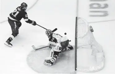  ?? SOKOLOWSKI/USA TODAY SPORTS] ?? Tampa Bay Lightning center Brayden Point (21) scores against Columbus Blue Jackets goaltender Joonas Korpisalo (70) during a playoff game last year. They will vie for the top of the newly formed Central Division this year. [JOHN E.