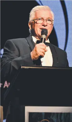  ?? ?? A dapper Terry James, standing in as Cairns mayor, launches the annual Mayor's Christmas Cheer Appeal at the Pullman Reef Hotel Casino.