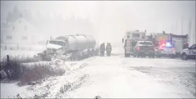  ?? COLIN MACLEAN/JOURNAL PIONEER ?? RCMP, firefighte­rs and Island EMS are shown at the scene of a two-vehicle collision on Route 2 in Springfiel­d, late Thursday afternoon. The crash involved a tractor-trailer and a Honda Civic.