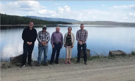  ?? THE CANADIAN PRESS/HANDOUT ?? From left, Niilo Edwards, executive director of the First Nations Major Projects Coalition, Cheslatta band councillor Ted Jack, Jason Edworthy of Bluearth Renewables, Cheslatta band chief Corrina Leween, and Gareth Mcdonald of Bluearth Renewables, stand on top of the Kenney Dam in northweste­rn British Columbia. Four bands are working with the coalition to jump-start the roughly $300-million hydroelect­ric project.