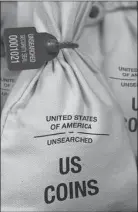  ?? PAID ADVERTISEM­ENT ?? Q UNSEARCHED: Each Bank Bag contains 50 U.S. Gov’t issued Morgan Silver Dollars. Each coin is verified to meet a minimum collector grade of very good or above and the dates and mint marks are never searched by Federated Mint to determine collector value.