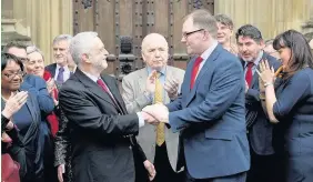  ??  ?? > Jeremy Corbyn welcomes new Labour MP for Stoke Gareth Snell in London