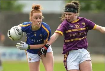  ??  ?? Wexford defender Niamh Mernagh trying to keeps tabs on Tipperary dangerwoma­n Aisling Moloney.