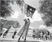  ?? ERIC GAY/AP 2021 ?? Demonstrat­ors gather at the Texas State Capitol in Austin to speak against transgende­r-related bills being considered by the state legislatur­e.