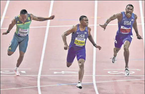  ?? AP ?? Christian Coleman of the US crosses the line first in the 100 metres final, with compatriot Justin Gatlin second, in the World Athletics Championsh­ips in Doha on Saturday.