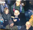  ?? (Eytan Halom) ?? RABBI ZEV LEFF studies Torah in the stands of the Nations League soccer game between Israel and Scotland in Glasgow.