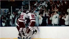  ?? DANIELLE PARHIZKARA­N/GLOBE STAFF ?? The Gloucester boys’ hockey team celebrates a first-period goal in Wednesday night’s 6-2 home victory over Walpole.