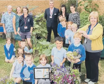  ??  ?? Pupils and staff from Ryhope Infant School with members of Gentoo and Durham Wildlife Trust.